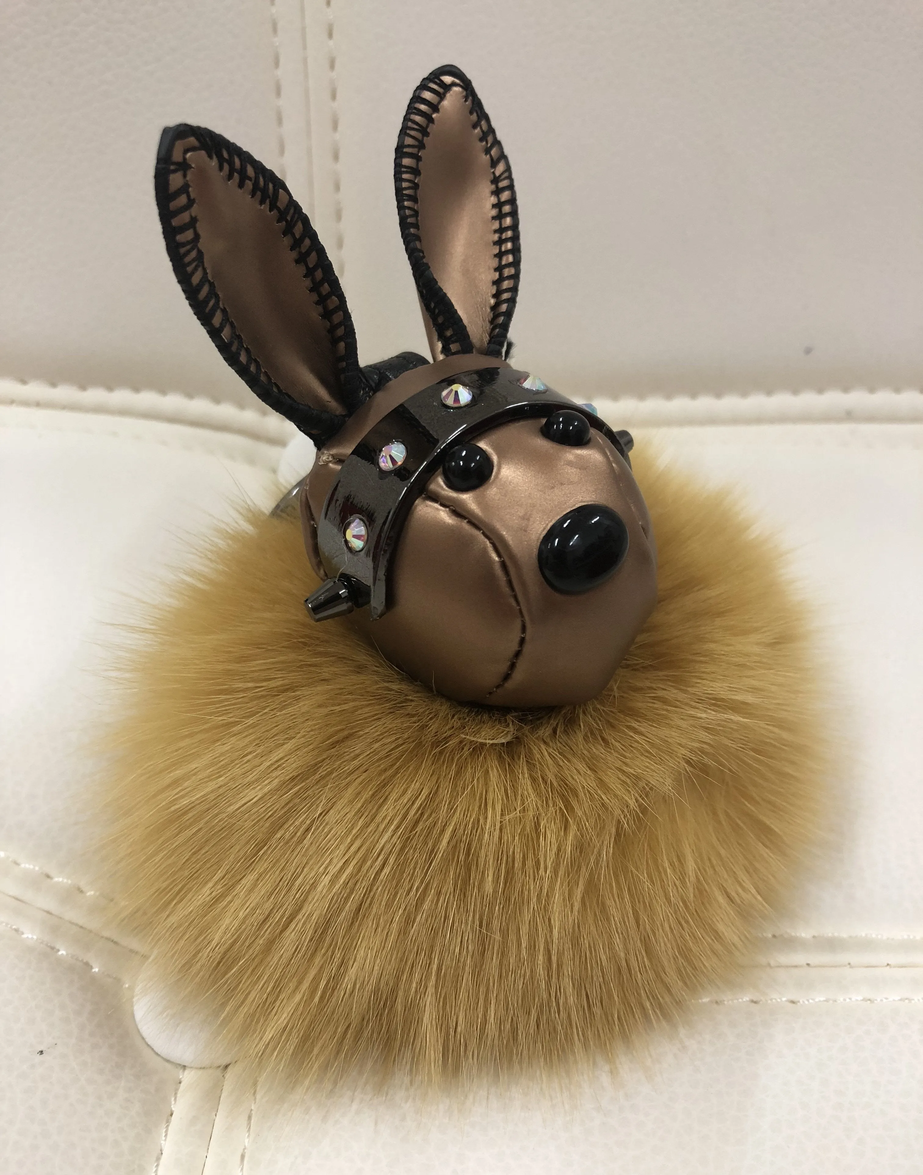 Leather rabbit with fur ball bag charm gold/maroon color